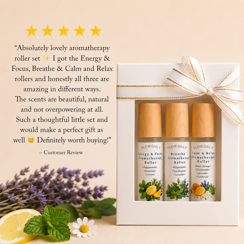 Glow Daily aromatherapy roller set with three bottles in a gift box, surrounded by lavender, lemon, and mint leaves.